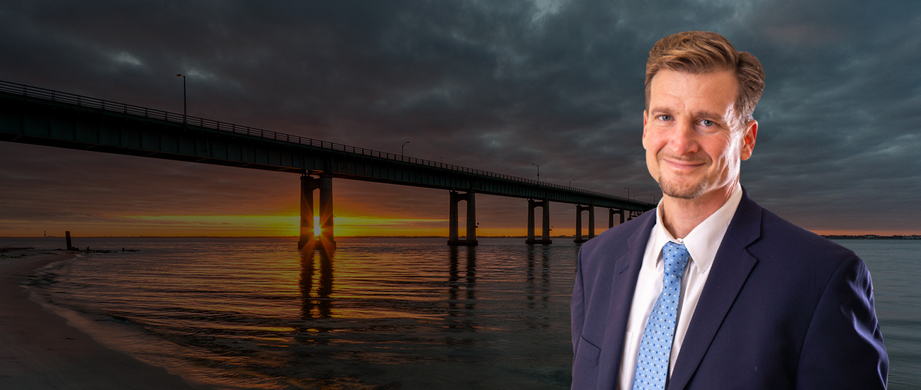 Darren M. Shapiro with a photograph of a bridge in the backgound